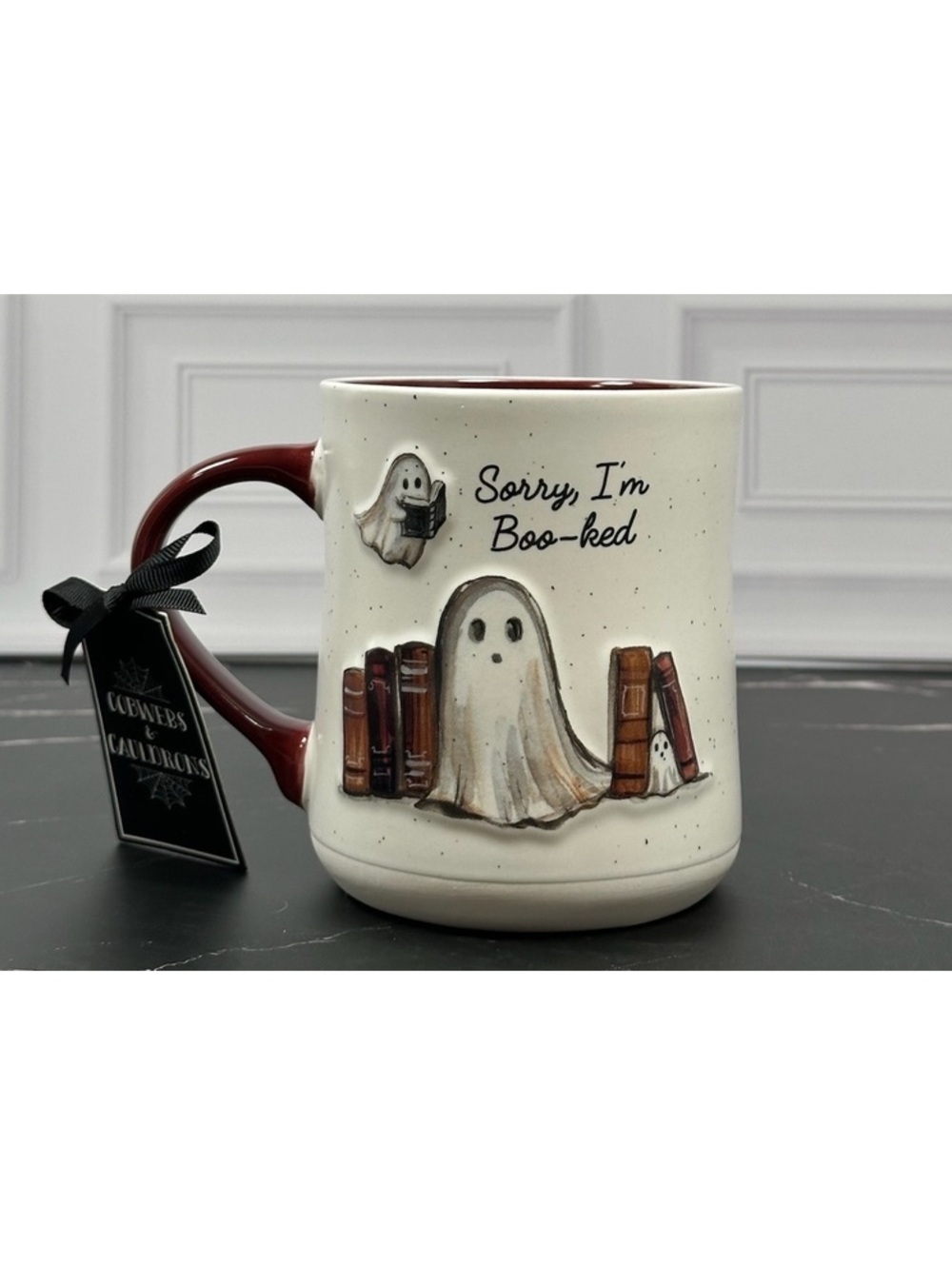 Ghost-Themed Coffee Mug with 'Sorry, I'm Boo-ked' Design and Book Stack